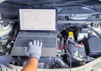 Car Maintenance - mechanic analyzing car